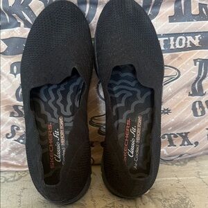 Skechers Black Knit Slip-Ons
Size 9 1/2